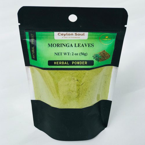 Close-up of vibrant green, finely ground Moringa Leaves Powder, showing its consistent, powdery texture.