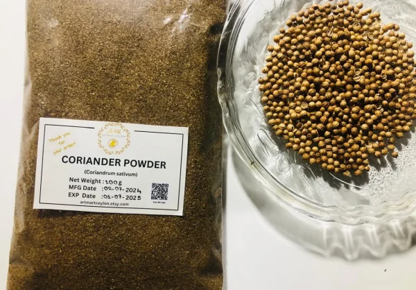 Hand sprinkling fine coriander powder into a simmering pot of curry or a bowl of food.