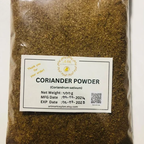 Close-up of finely ground, light brown coriander powder, showing its consistent, earthy texture.