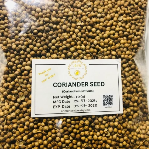 Close-up of light brown, round whole coriander seeds, showing their ribbed texture and consistent size.