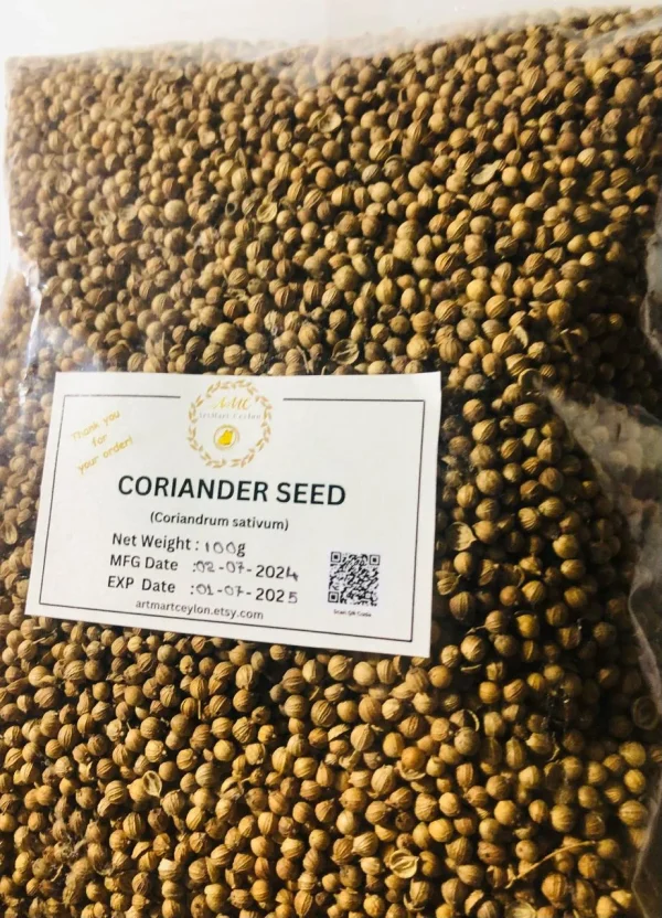 Whole coriander seeds being lightly toasted in a hot pan, emphasizing aroma release.