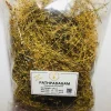 Dried Pathpadagam herb steeping in hot water in a glass or traditional pot, yielding a light, clear herbal decoction.