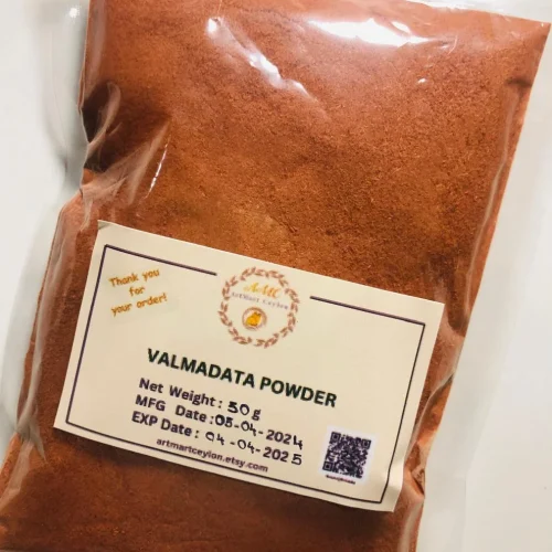 Close-up of finely ground, reddish-brown Welmadata Manjishta Powder, showing its rich color and soft texture.