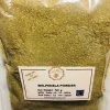 Close-up of finely ground, light green to earthy brown Welpenela Powder, showing its consistent, soft texture.