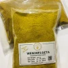Dried slices of Wenivelgeta (Tree Turmeric) stem/root next to a pile of finely ground Wenivelgeta powder.