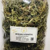 Close-up of dried Wishnu Kranthi (Evolvulus alsinoides) herb, showing its small oval leaves, slender stems, and remnants of tiny flowers.