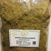 Close-up of finely ground, light green to earthy brown Wishnu Kranthi powder, showing its consistent texture.